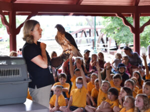 Visiting Storytime - Hawk Hill Raptors - Woman holding a hawk