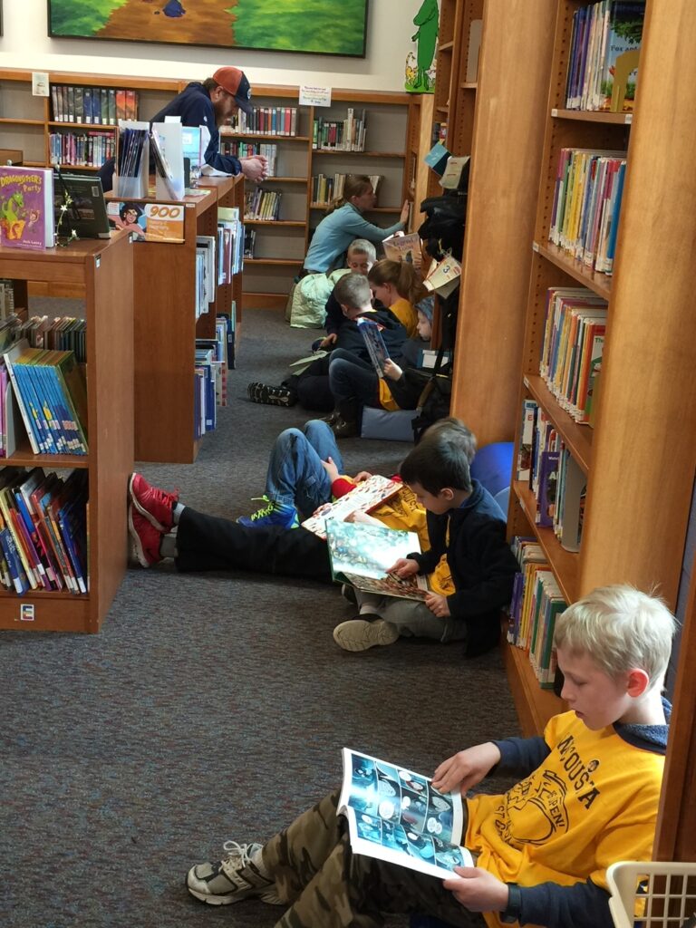 Kids reading in the children's department
