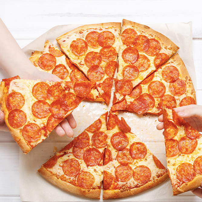 Kids holding a slice of pizza