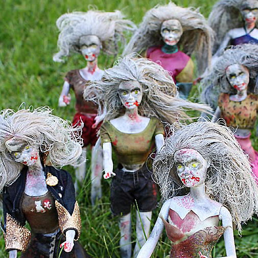 Barbies painted like zombies