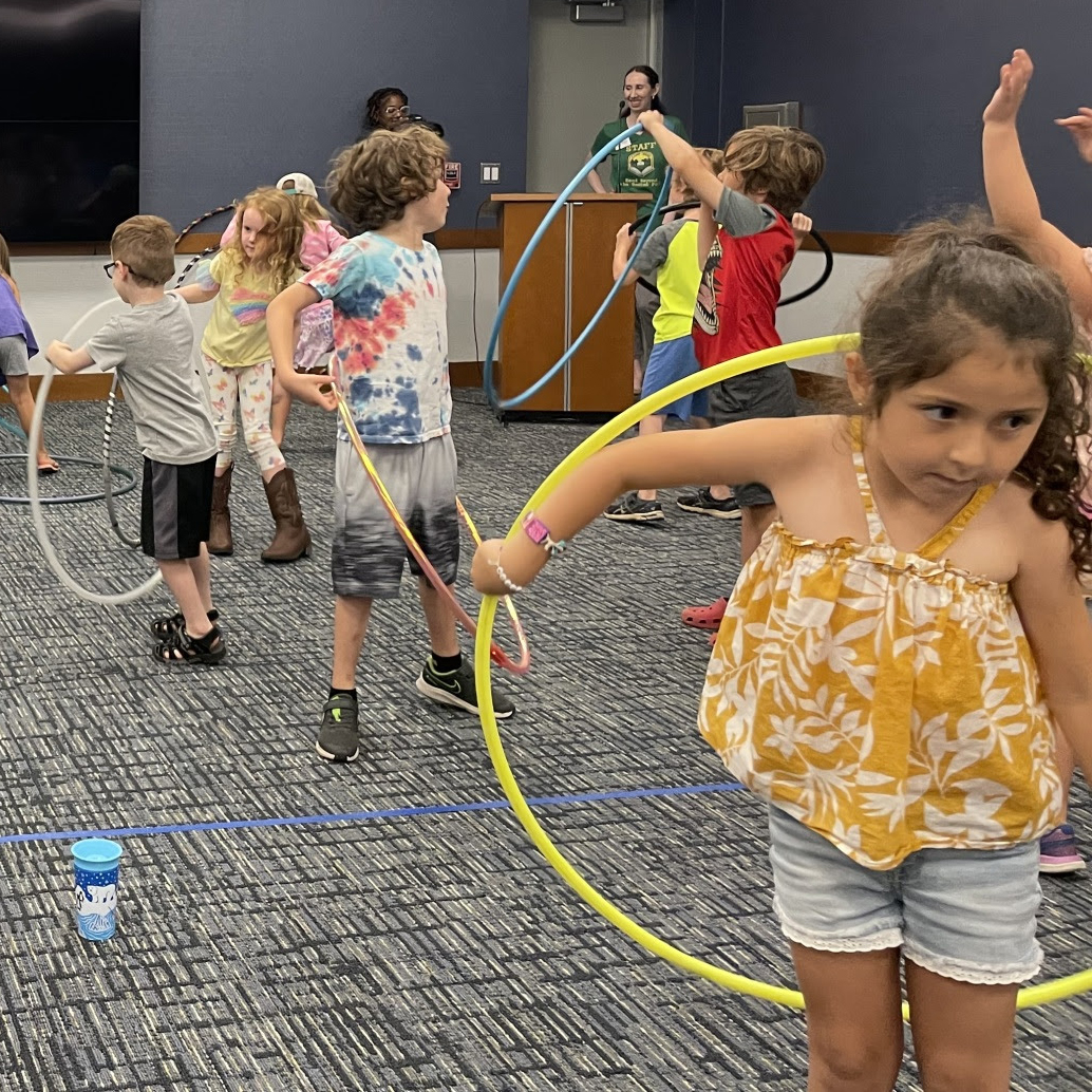 Kids learning how to hula hoop