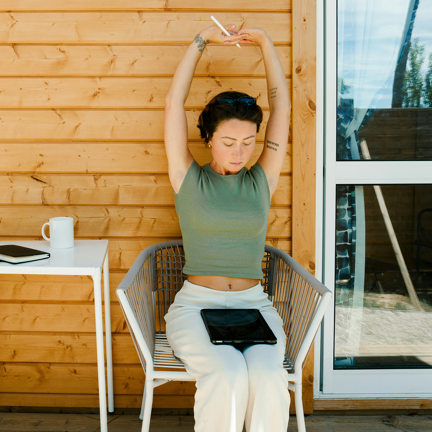 Woman stretching in a chair