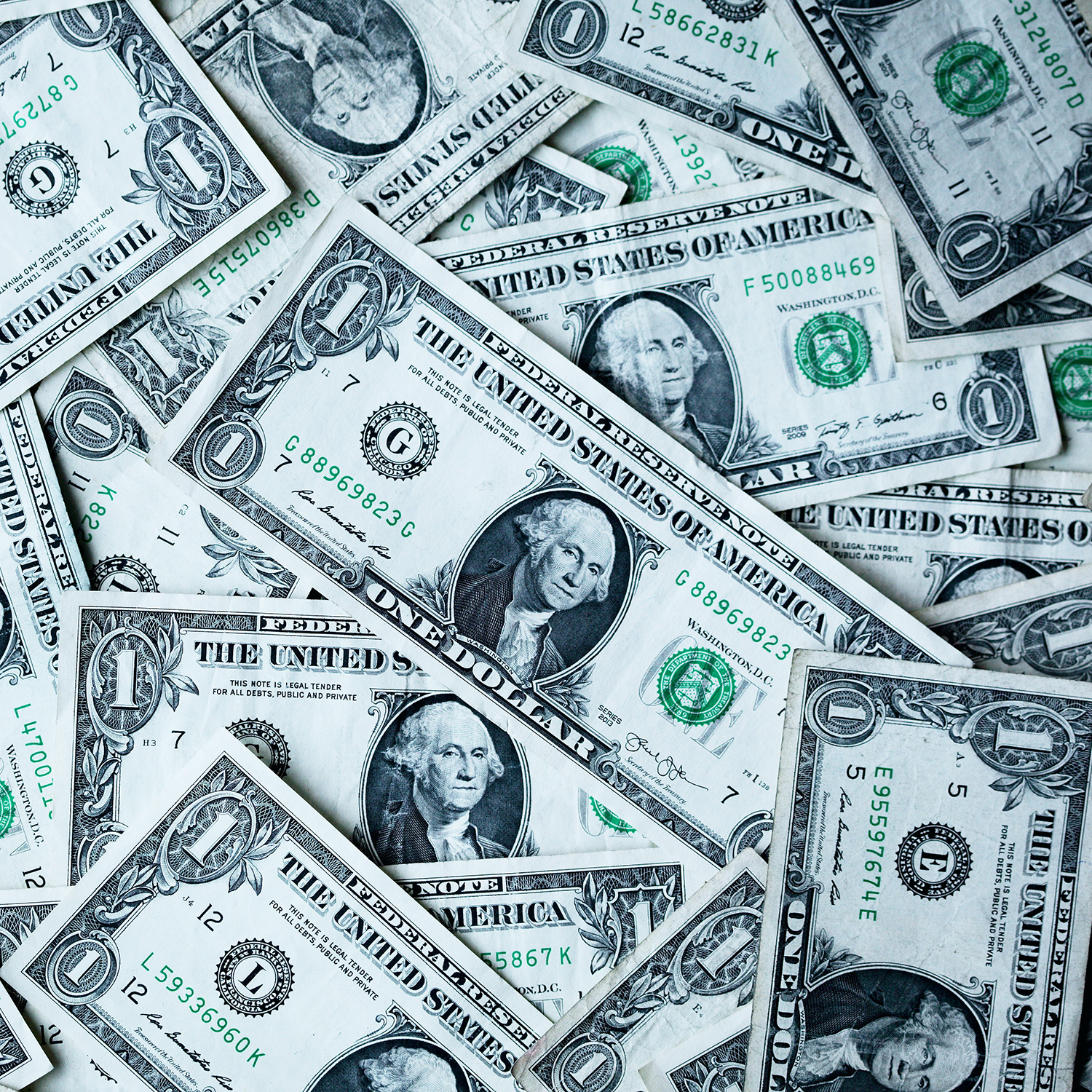 Pile of one dollar bills