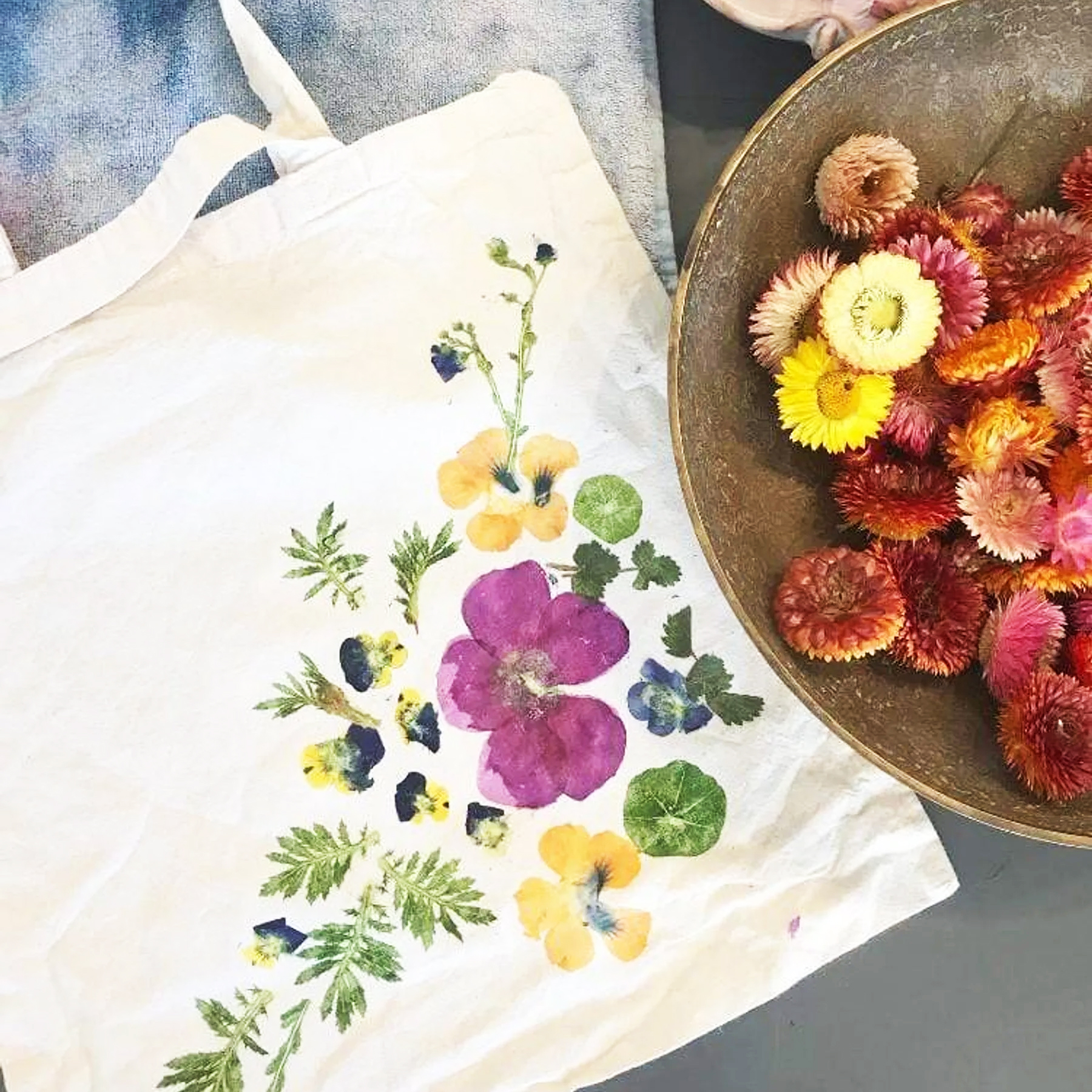 Flower pigments pounded onto tote bags