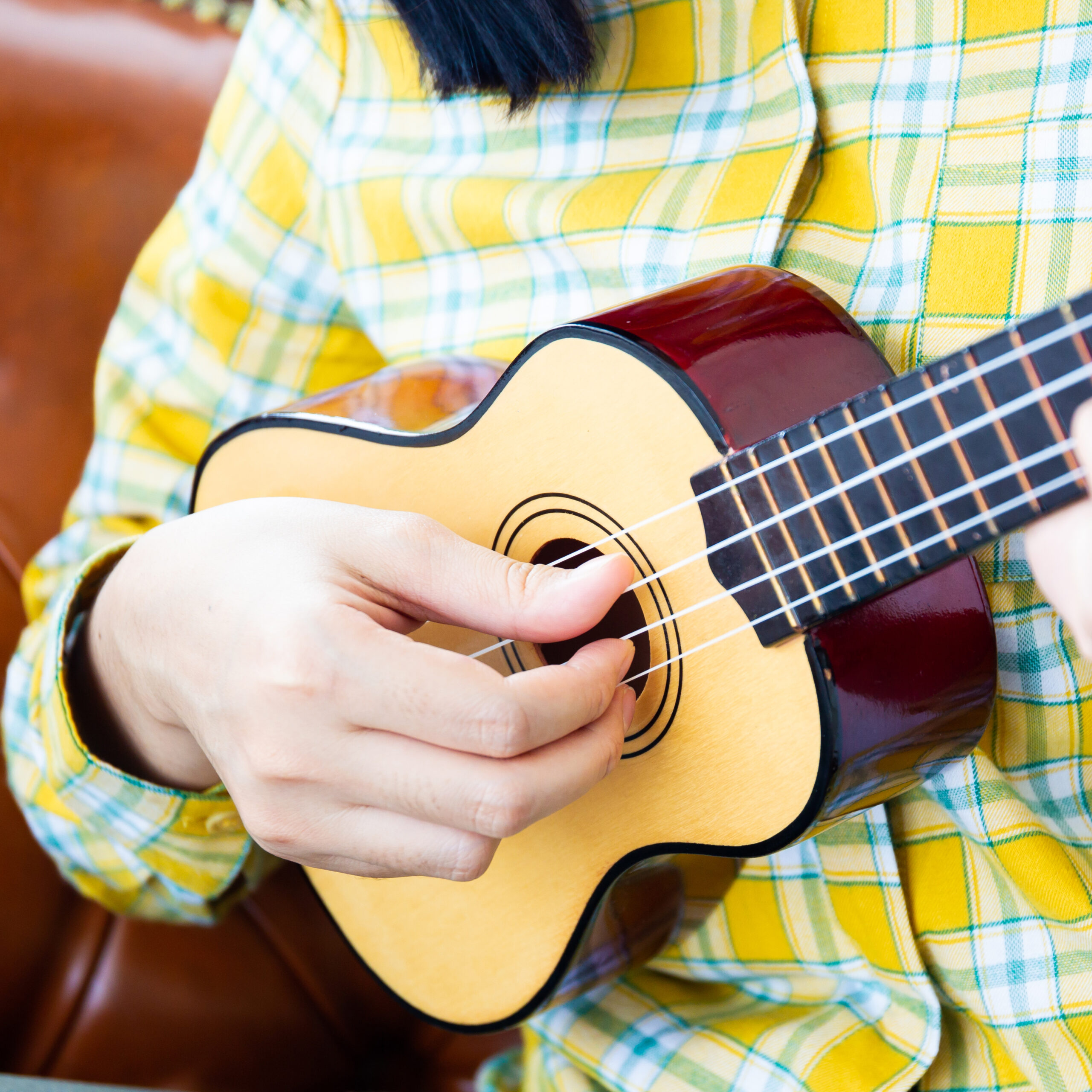 Person playing a Ukulele